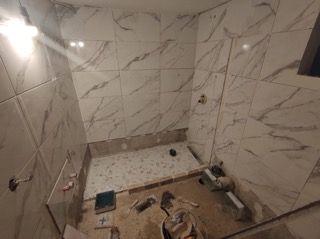 Shower with tiles missing